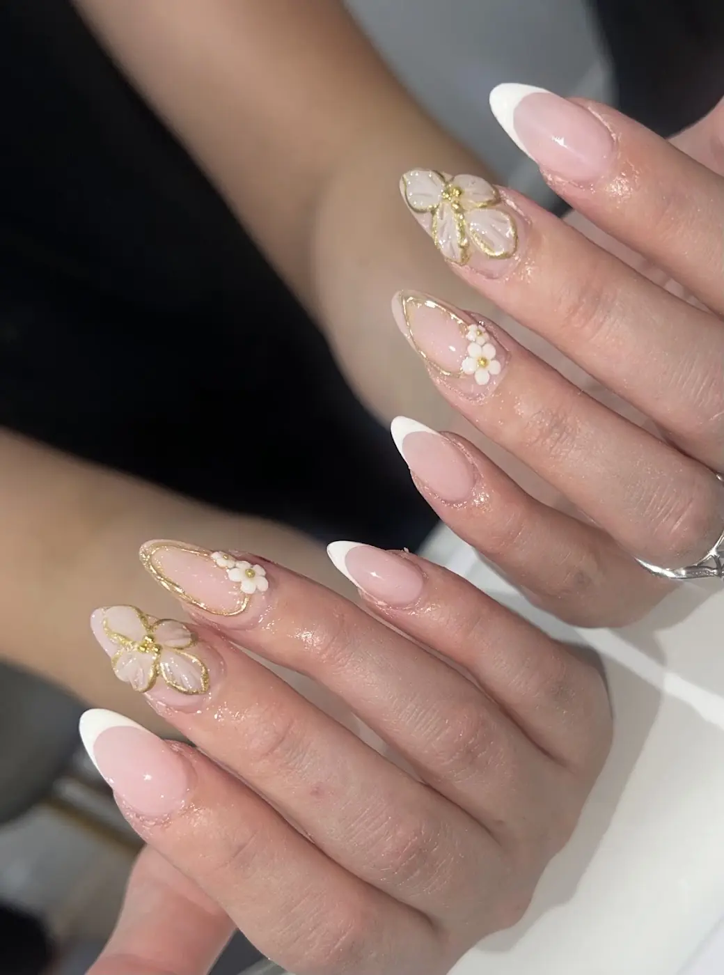 French tips with gold flower nail art