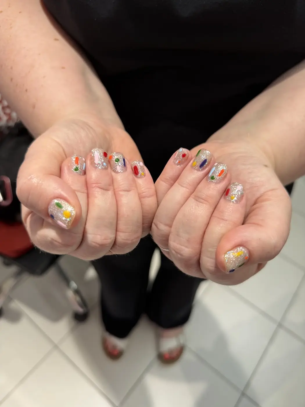 Short nails with mini nail art on each finger
