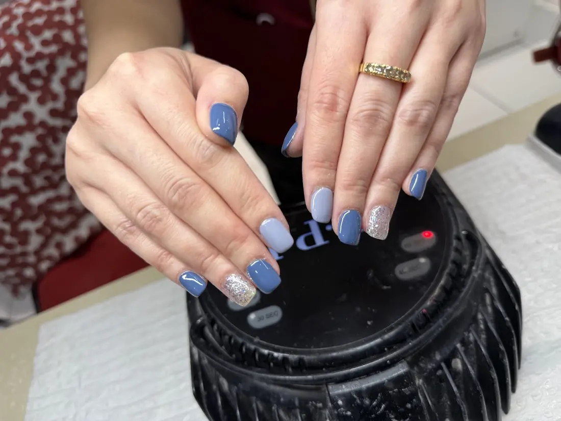 Periwinkle blue nails with one glitter accent